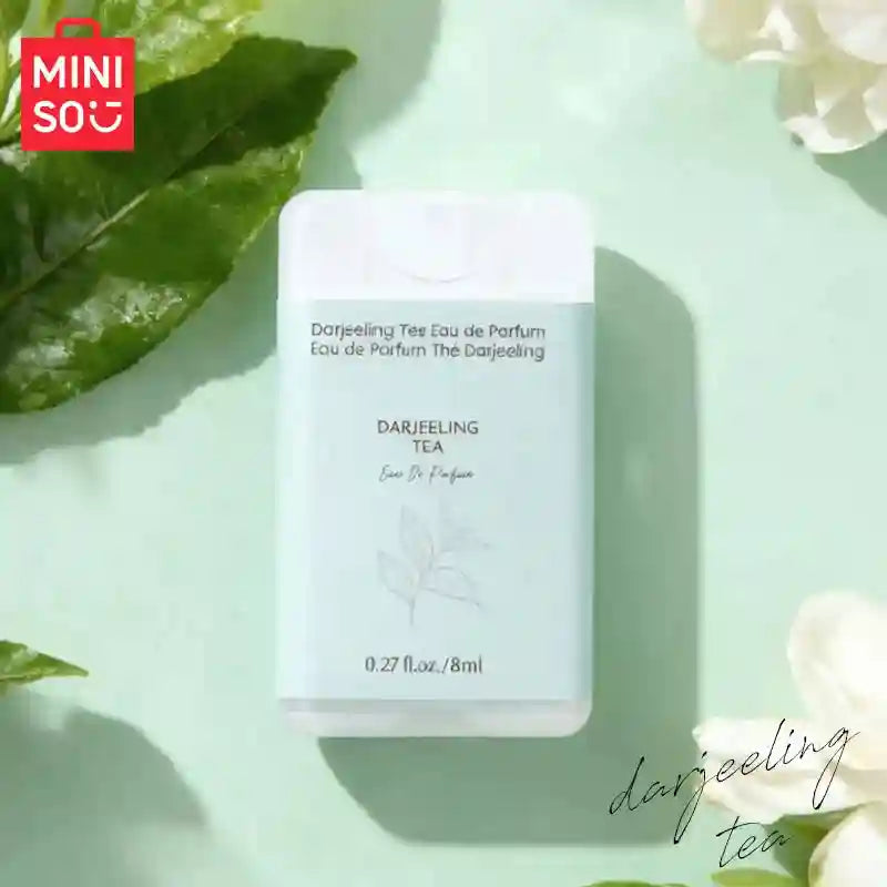 MINISO Darjeeling Tea EDP for men: 8ml portable pocket woody fragrance spray in a flat rectangular bottle.