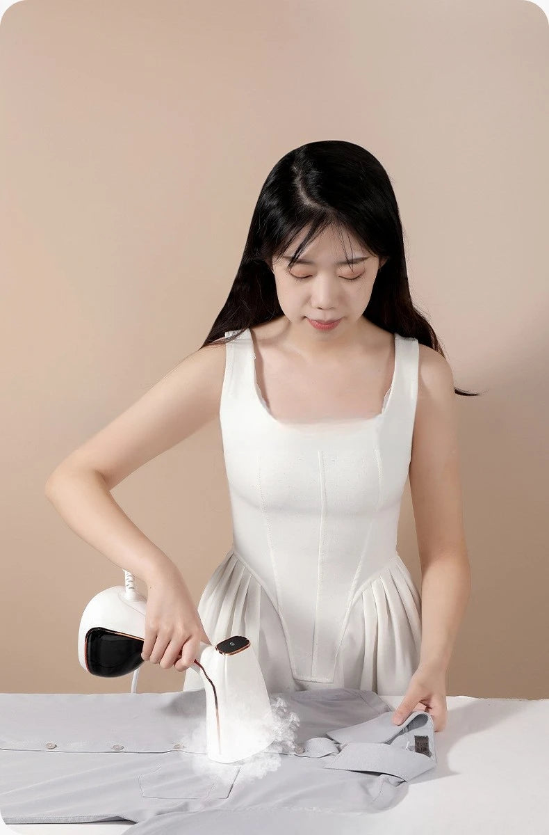Tidesmit portable handheld garment steamer for quick wrinkle removal on clothes, 18th view showing steam nozzle.