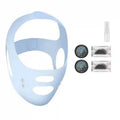 Light blue V-line facial lifting strap, two circular digital EMS control units, a spray bottle, and conductive gel pads.