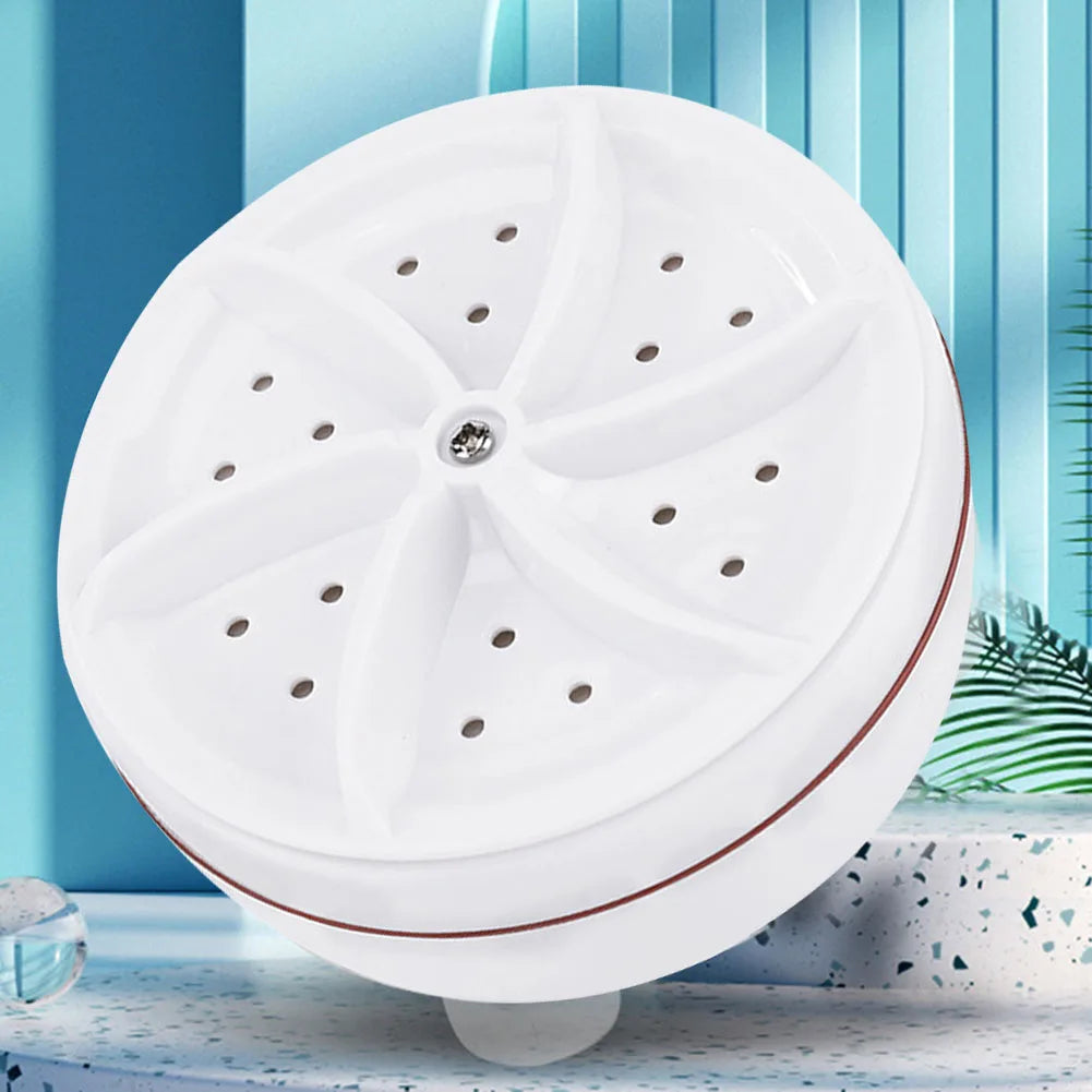 Tidesmit portable ultrasonic turbine washer spinning in basin for cleaning socks and underwear, side view