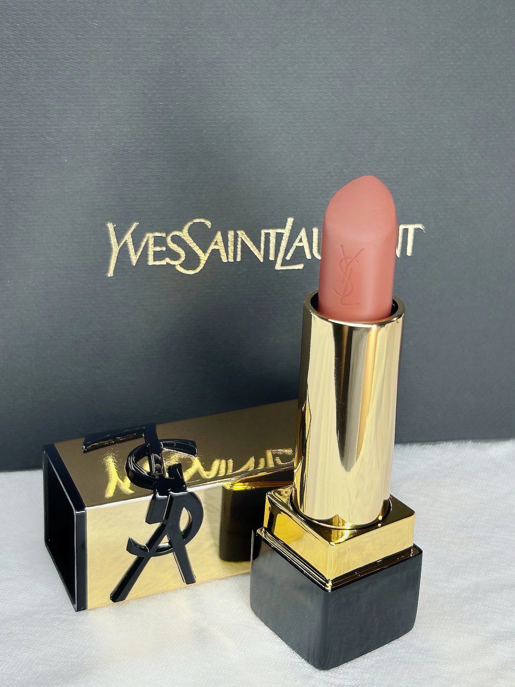 YSL Rouge Pur Couture Nu Muse mini lipstick in a nude satin finish with gold casing and branded black box.