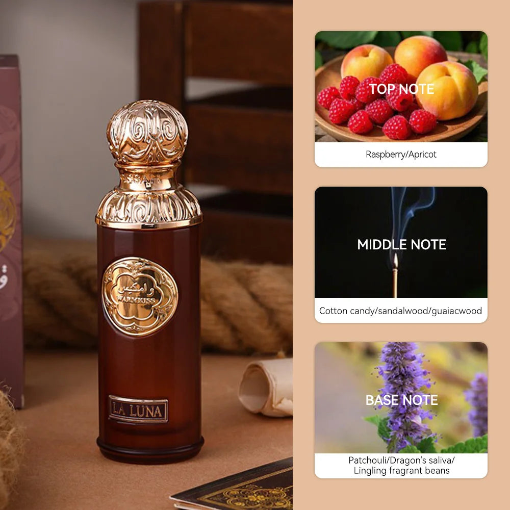 La Luna perfume in a tall brown glass bottle with an ornate gold cap, featuring scent notes of fruit, wood, and floral.