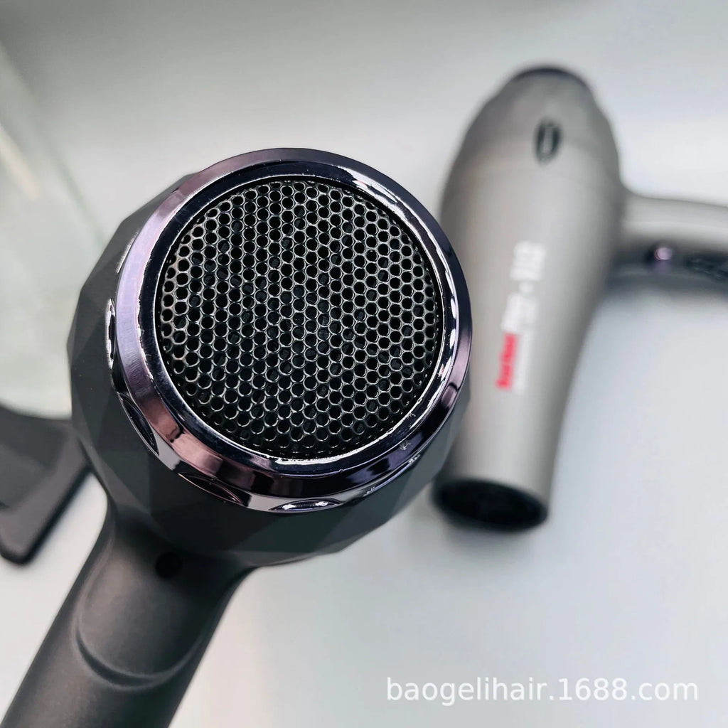 Close-up of a 2600W high-power negative ion hair dryer with a sleek matte black geometric design and metallic finish.