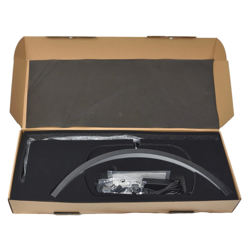 Black arc-shaped LED nail lamp with power adapter, packed in a cardboard box with foam inserts for protection.