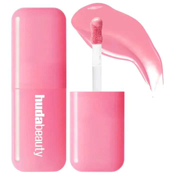 Huda Beauty pink hydrating lip and cheek tint stick with creamy texture and swatch applicator.