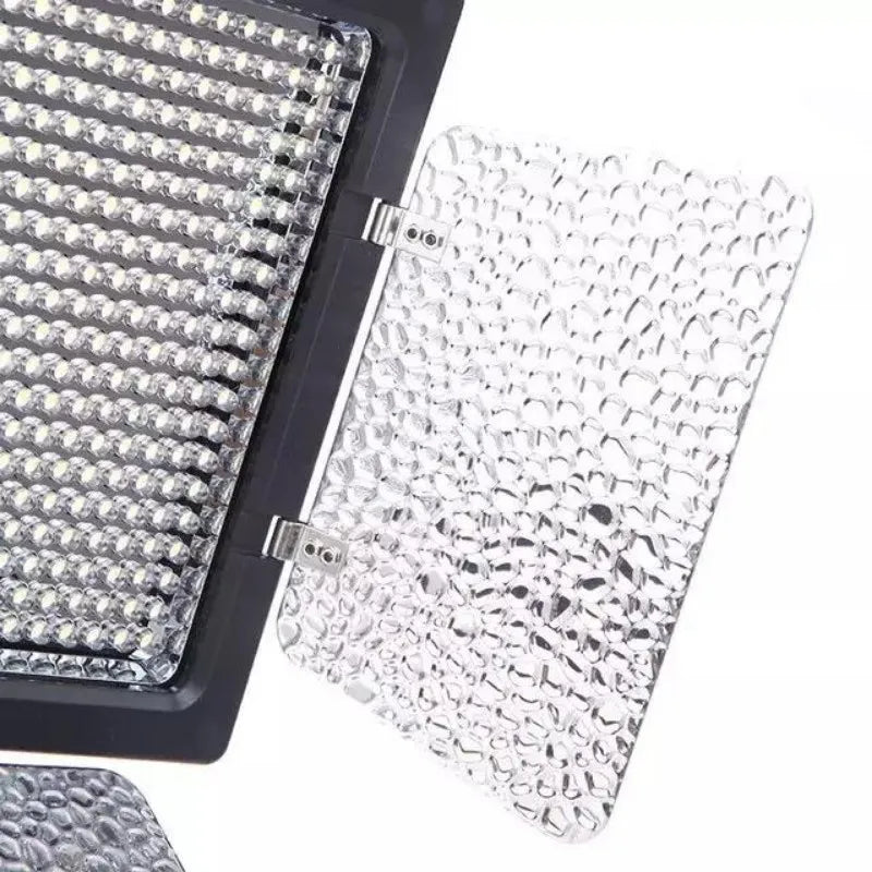 LED video light panel with a black frame and a textured, translucent plastic diffuser flap for soft lighting.