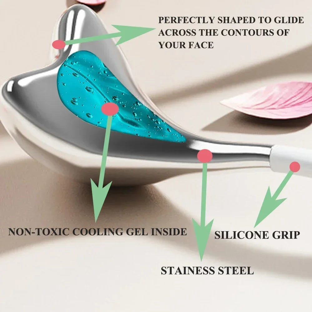Heart-shaped stainless steel facial cryo tool with a blue cooling gel center and a white silicone grip.