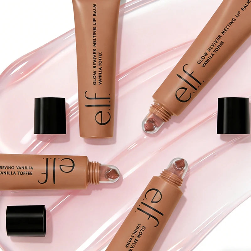 e.l.f. Glow Reviver Melting Lip Balm in Vanilla Toffee, a creamy nude moisturizing lip gloss on a pink glossy surface.