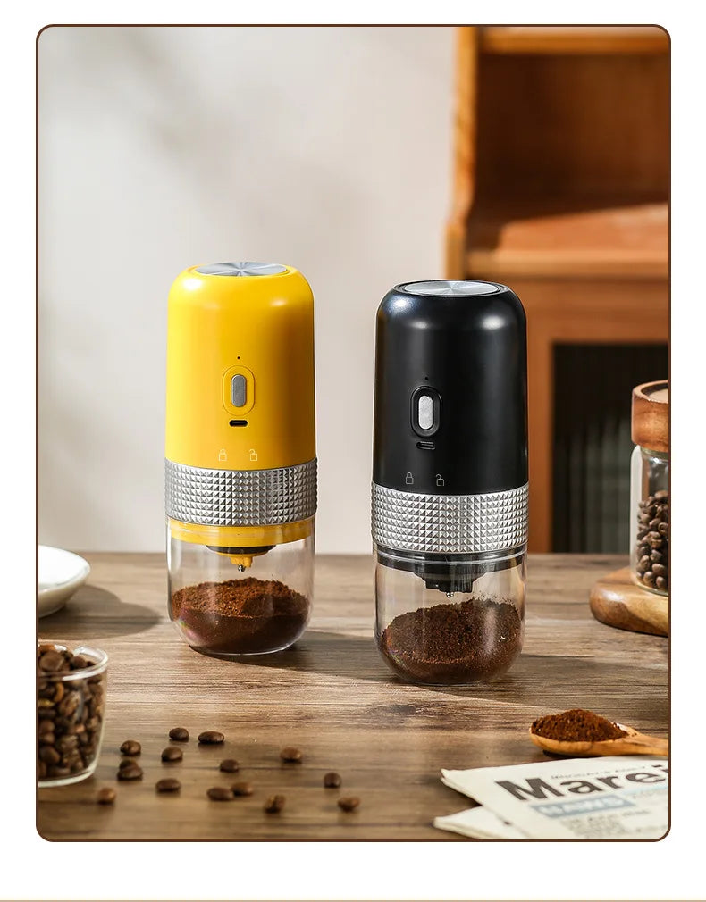 Portable electric coffee grinders in yellow and black with a clear glass grounds container and textured silver band.