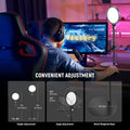 Black circular LED ring light on an adjustable metal stand with a weighted base, used for desktop streaming lighting.