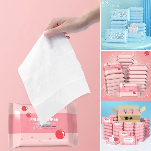 Hand holding a soft baby cleansing wipe from a 10-count pack of apple-scented fruit baby wipes for gentle skin care.