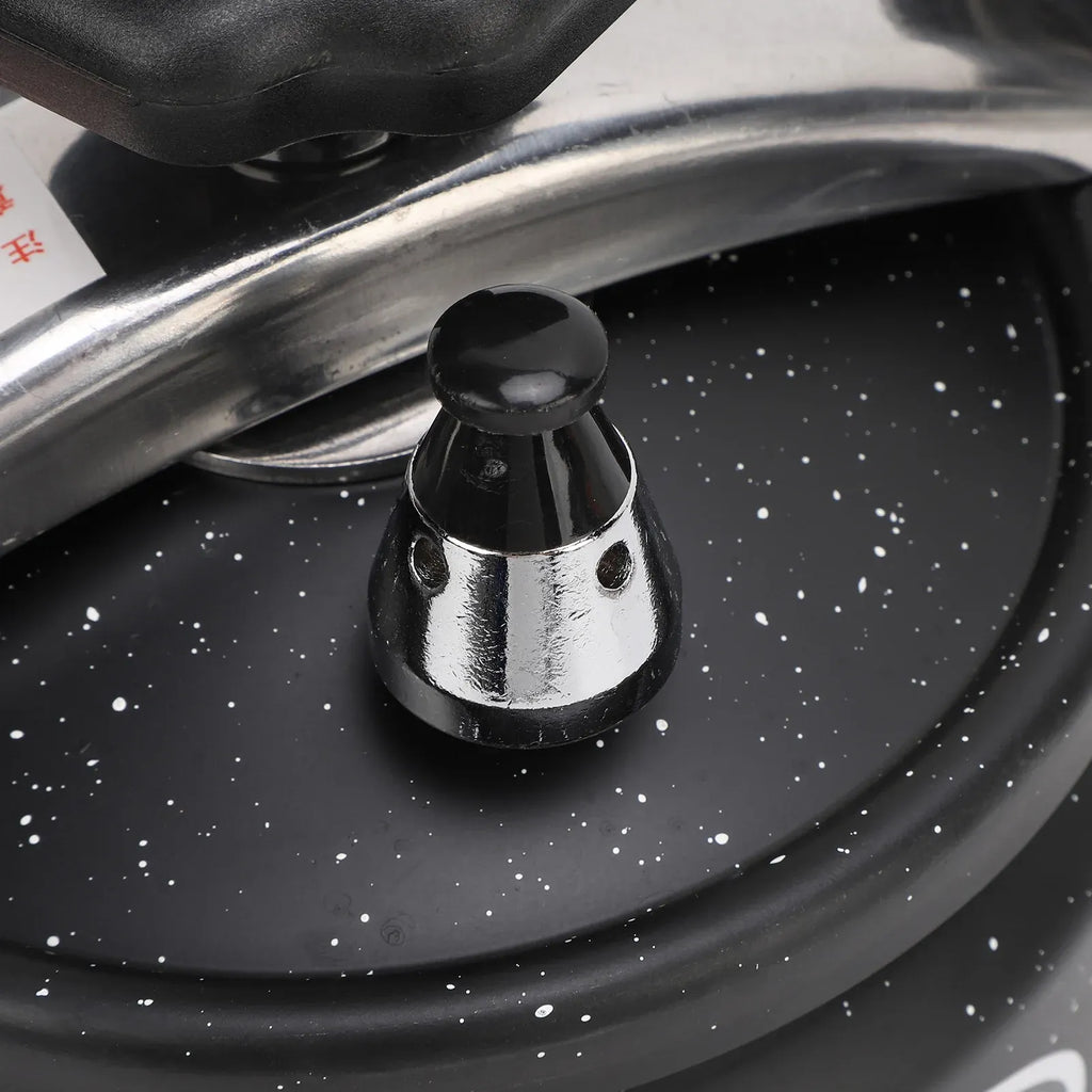Black pressure canner valve with black cap on metal stem over speckled lid