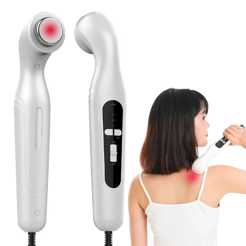 White handheld ultrasound physiotherapy device for muscle pain relief, used on shoulder, with controls and red light.