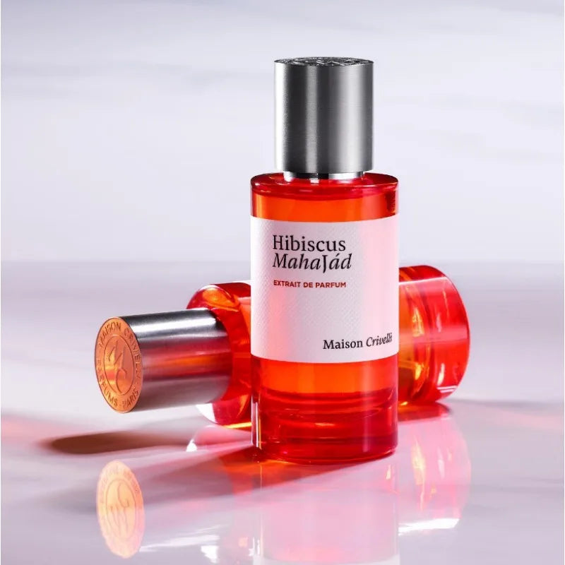 Maison Crivelli Hibiscus Mahajád Extrait de Parfum, unisex luxury scent in a sleek red cylindrical glass bottle.