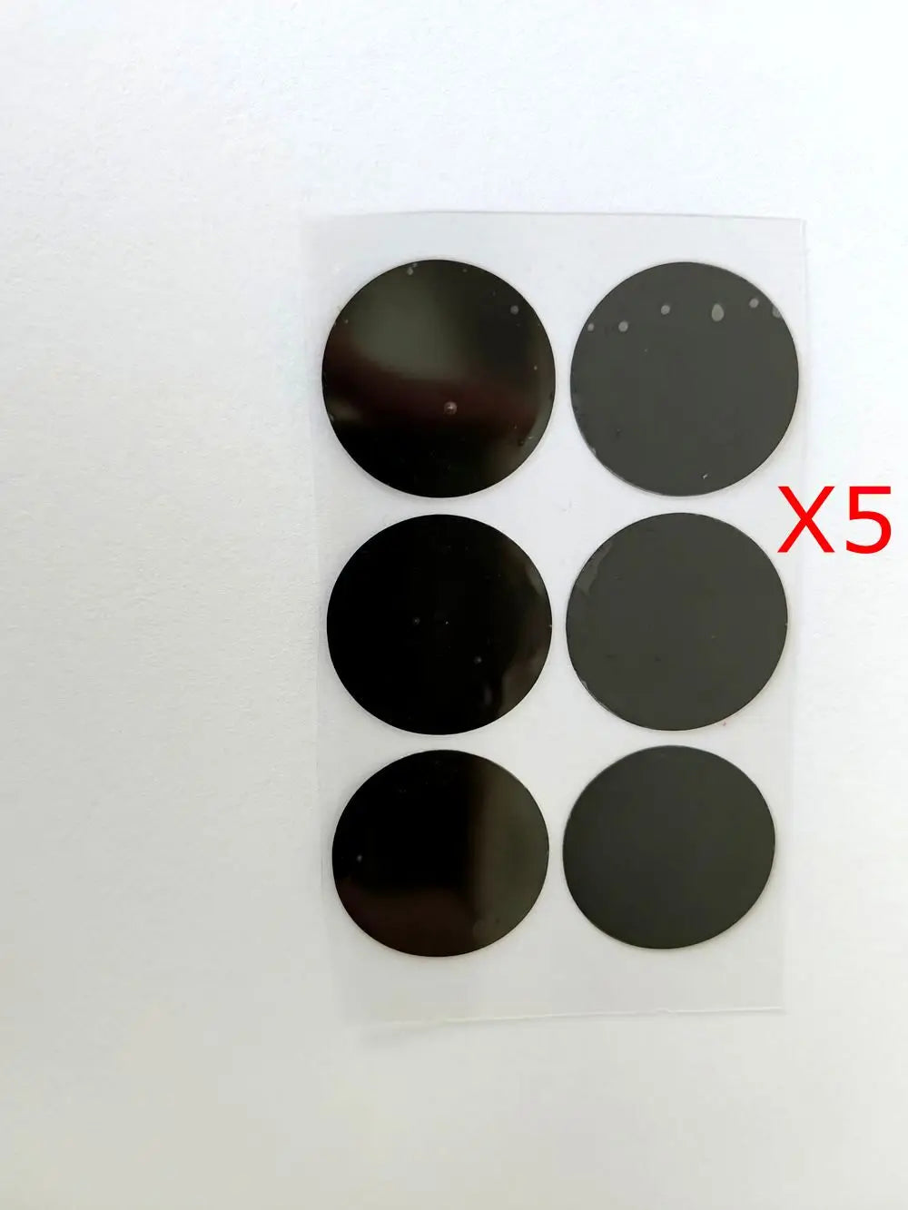 Pack of 5 black 28mm diameter circular film stickers for Vmax HIFU cartridge replacement on a transparent backing.