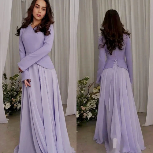 Tidesmit lilac A-line gown with V-neck, long sleeves, and a corset-style lace-up back in flowing, lightweight fabric.