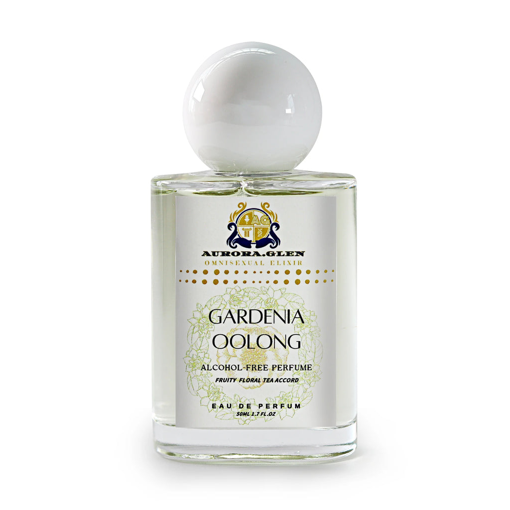Glass bottle of Aurora Glen Gardenia Oolong alcohol-free perfume with white round cap and floral label.