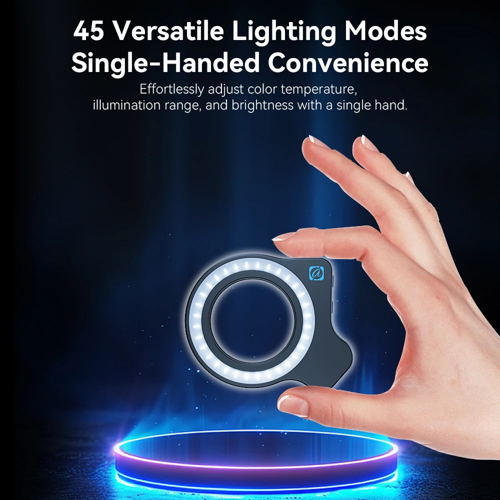 Small, black, circular LED ring light held by hand for portable photography and video lighting.