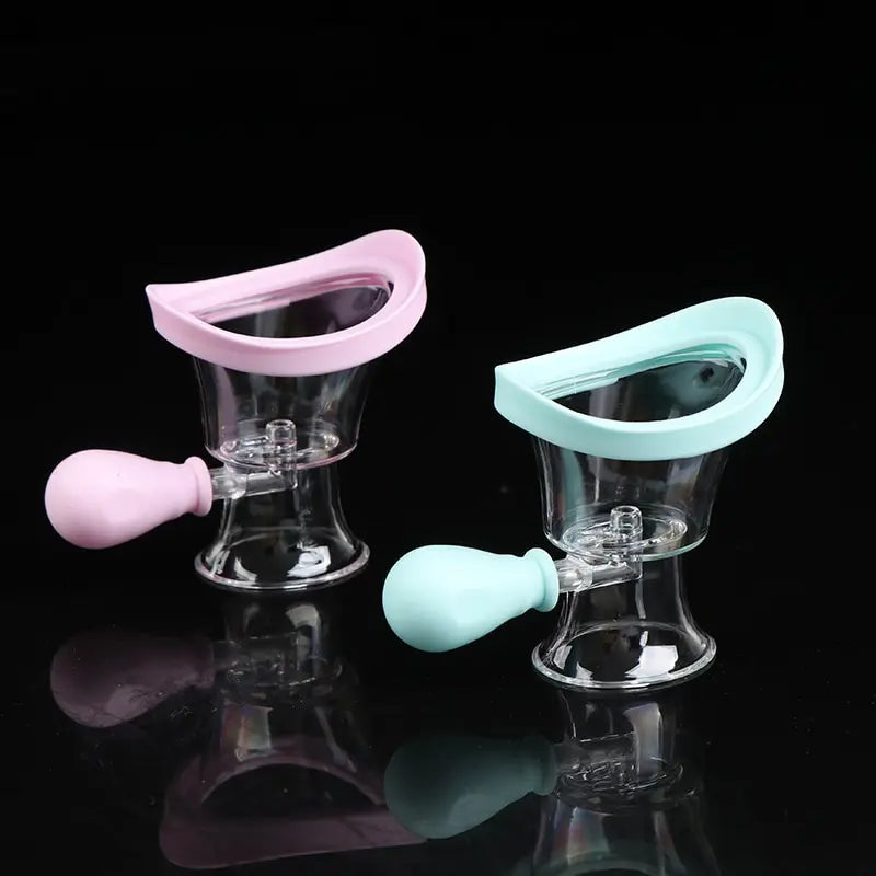 Soft silicone eye wash cups in pink and blue with manual squeeze bulb for gentle eye flushing and rinsing.