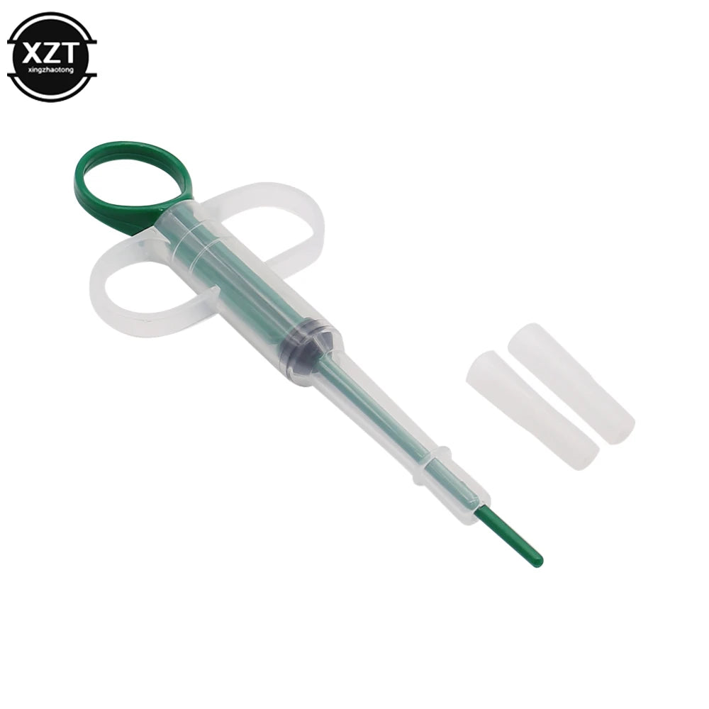 Green pet pill dispenser and medicine syringe for easy feeding of tablets, water, or milk to dogs and cats.
