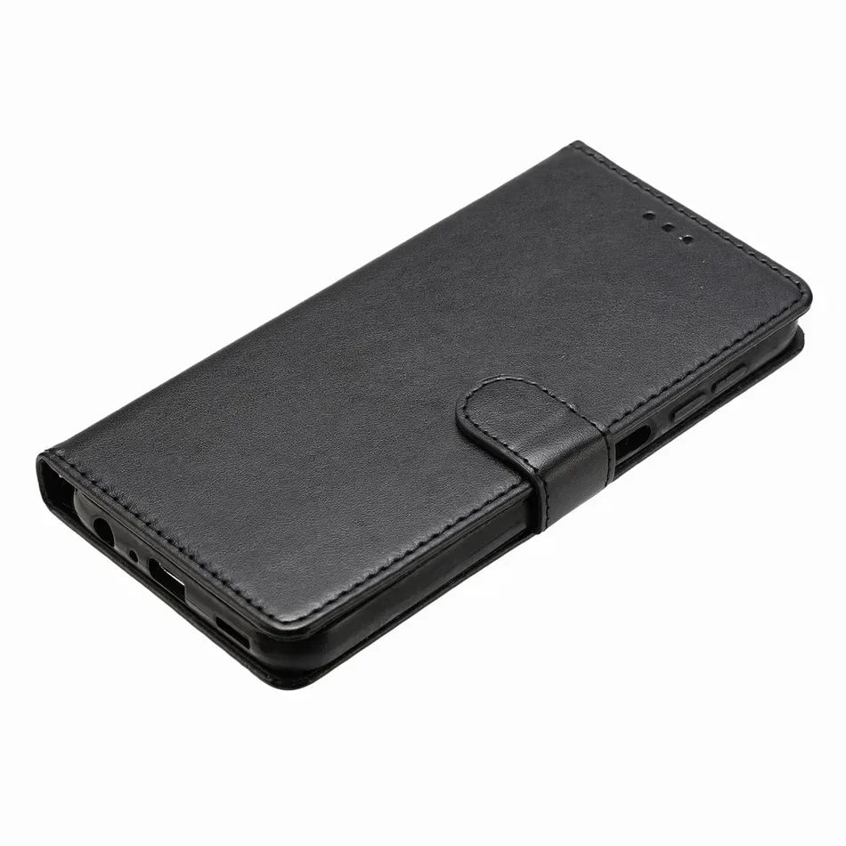 Black leather wallet-style phone case with a magnetic strap closure to protect and carry a smartphone.