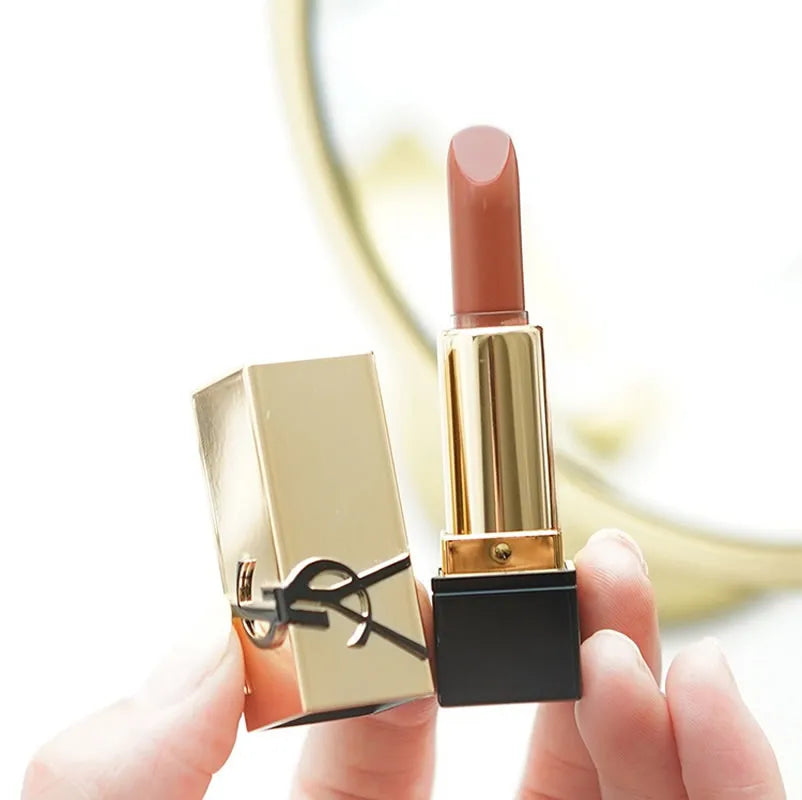 YSL Rouge Pur Couture mini lipstick in Nu Muse: a moisturizing, satin-finish nude shade in luxury gold packaging.