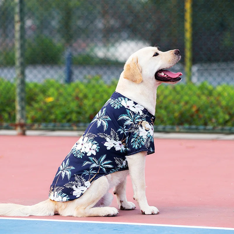 Labrador wearing a breathable navy blue Hawaii-style palm print dog t-shirt for comfortable summer pet fashion.