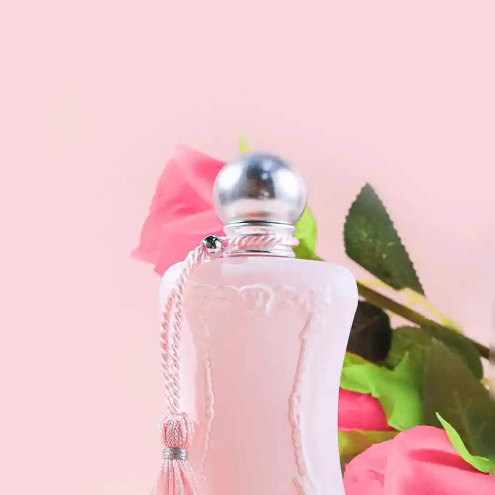 Luxury 75ml floral Eau de Parfum for women in a vintage pink bottle with tassel, pheromone-infused lasting scent.