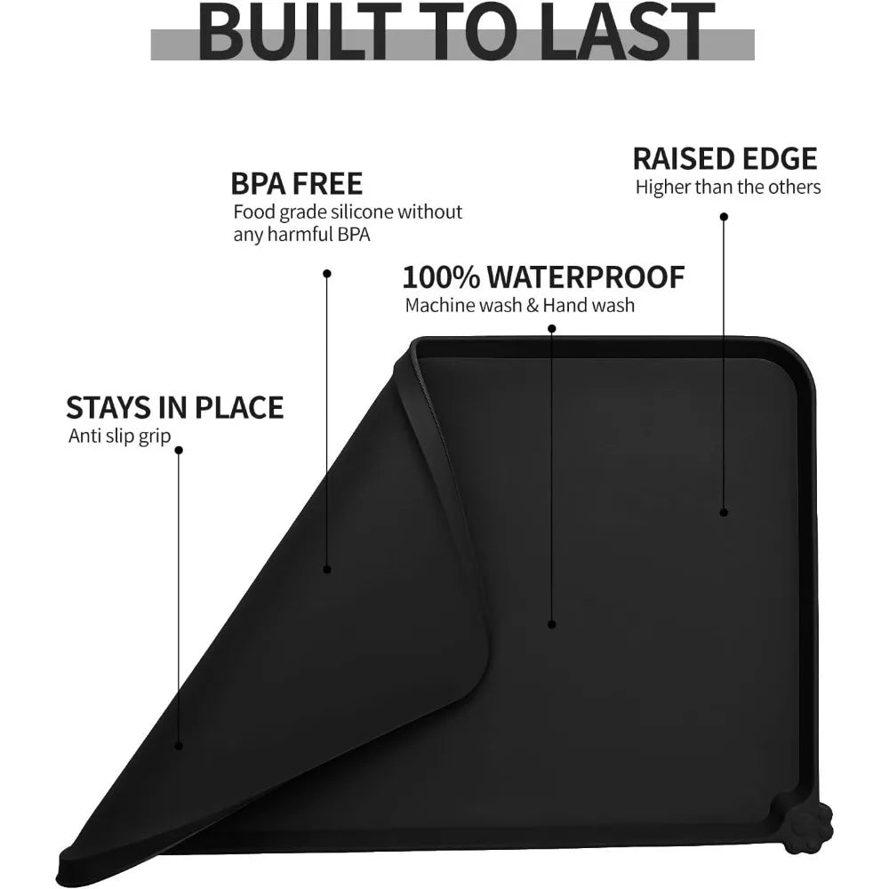 Waterproof black silicone pet feeding mat with raised edges for spill-free dog and cat food bowls. BPA-free, anti-slip.