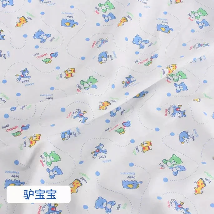 Tidesmit white knit jersey fabric featuring a colorful repeating print of baby animals and blue polka dots.