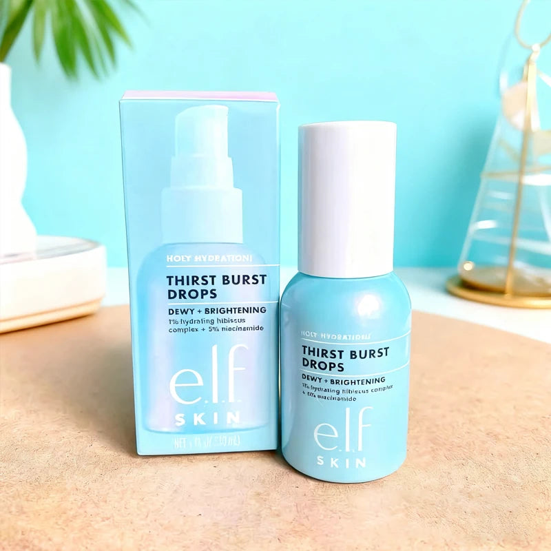 e.l.f. Skin Thirst Burst Drops with hibiscus and niacinamide in light blue packaging on a wooden surface.