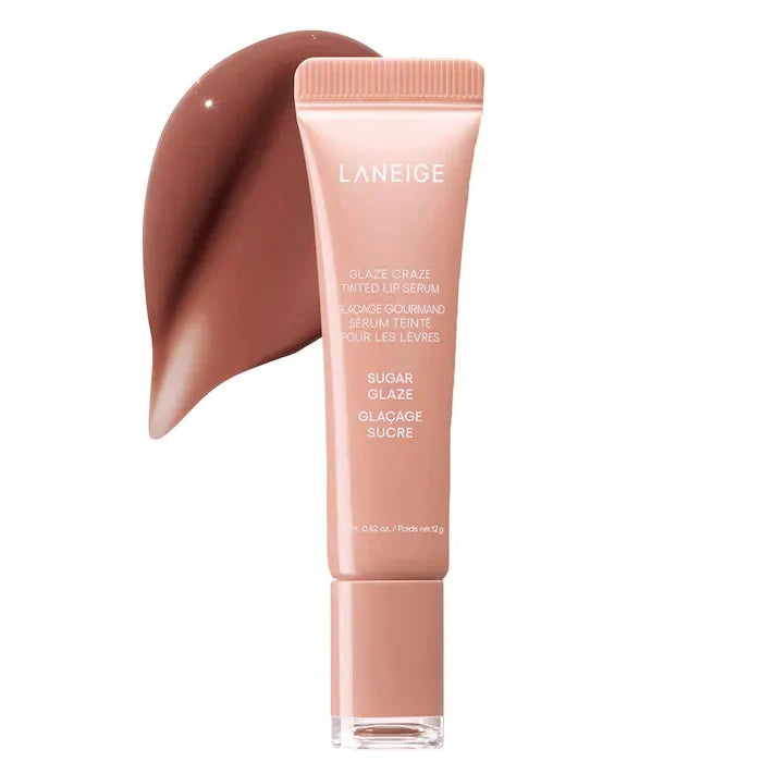 Laneige Glaze Craze Tinted Lip Serum in Sugar Glaze. Glossy brown-toned swatch next to a peach squeeze tube.