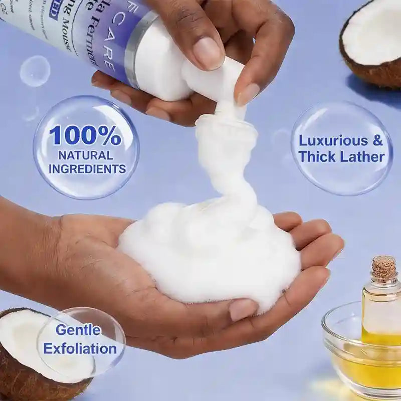 AFCARE cleanser mousse being dispensed as a thick, white, soft foam into a person's hand, with coconut and oil accents.