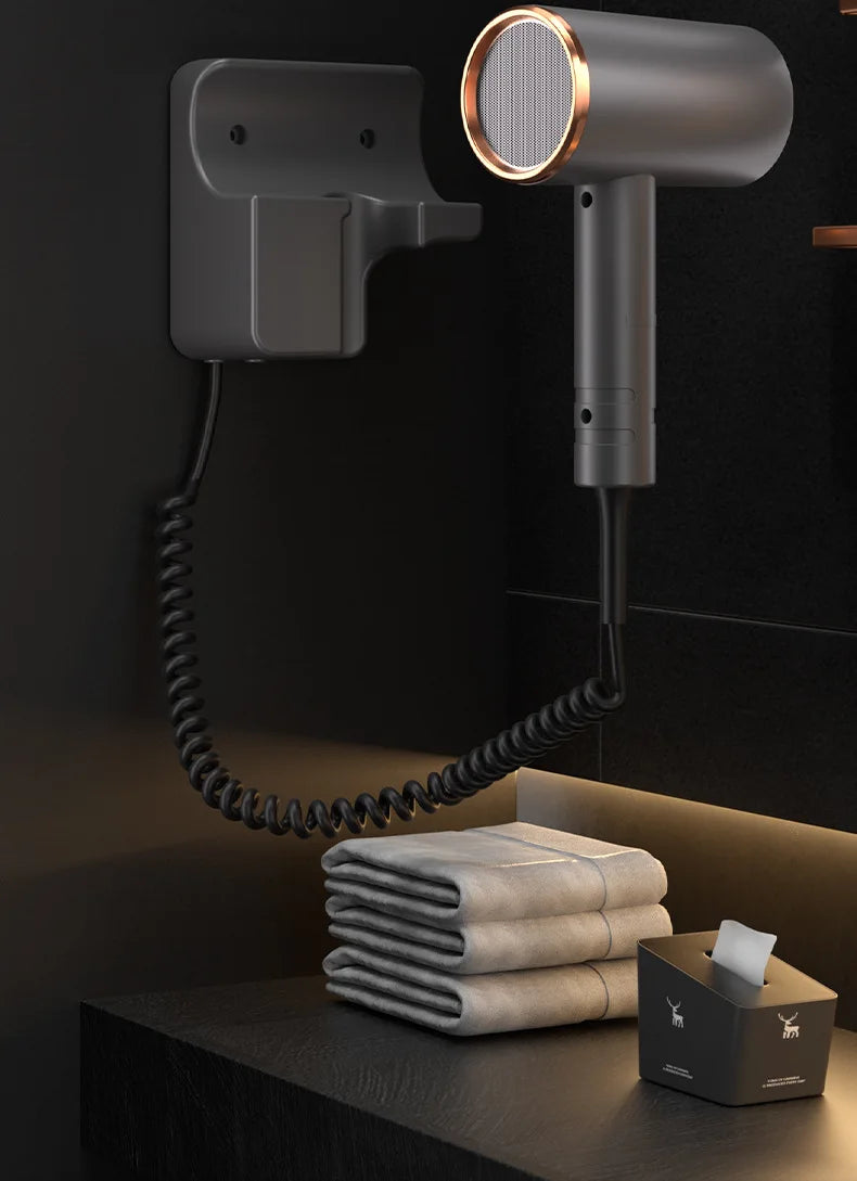 Modern dark grey wall-mounted hotel hair dryer with blue light technology and secure curly cord dock.
