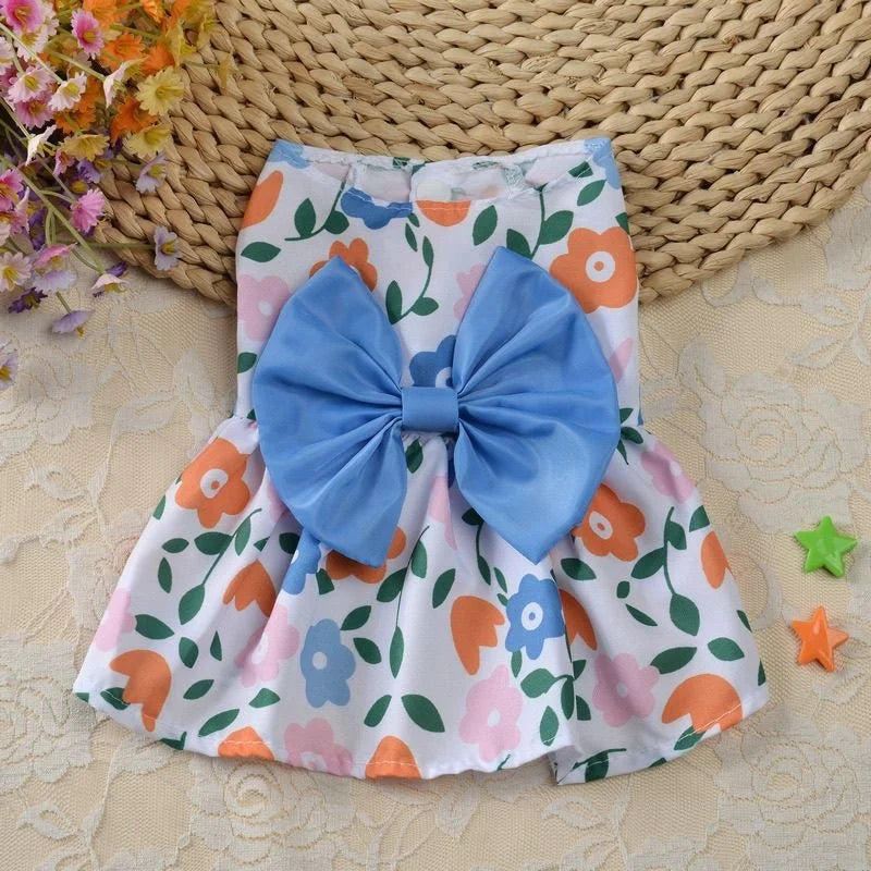 Cute floral spring dog dress with blue bow for small puppies and cats. Lightweight summer pet apparel for daily wear.