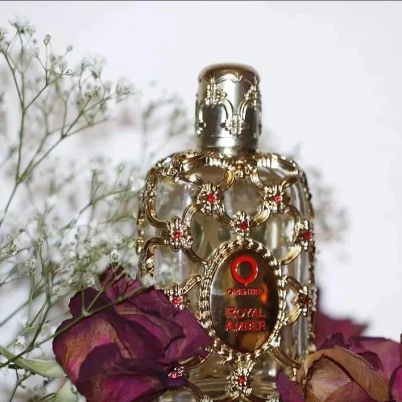 Orientica Royal Amber 100ml EDP: Luxurious unisex fragrance in an ornate gold cage bottle with warm amber notes.