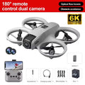 Gray 6K dual-camera drone with propeller guards, remote controller, battery, and accessories for aerial photography.