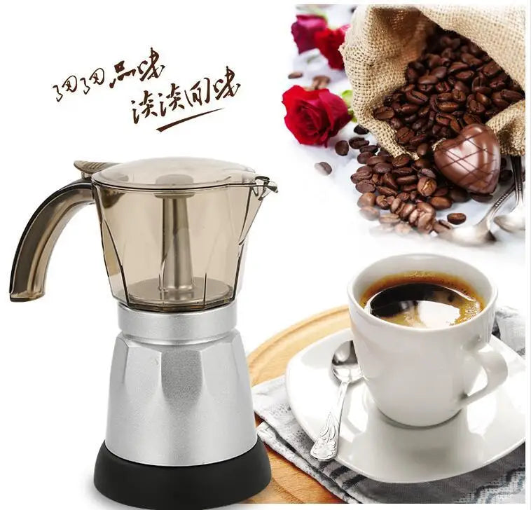 Silver and translucent moka pot espresso maker with a black base next to a cup of coffee and coffee beans.