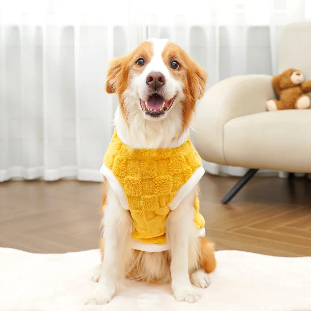 Happy dog wearing a yellow plush winter sweater. Warm, cozy fleece dog coat for small to large pets.