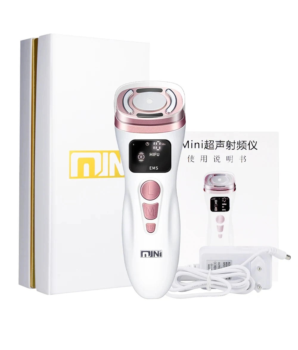 White and rose gold mini HIFU facial device with digital display, buttons, manual, and power adapter in a gift box.