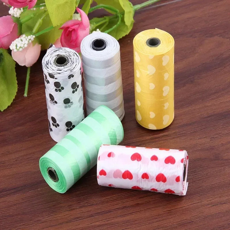 Colorful, leak-proof dog poop bags with cute paw and heart prints for easy pet waste cleanup.