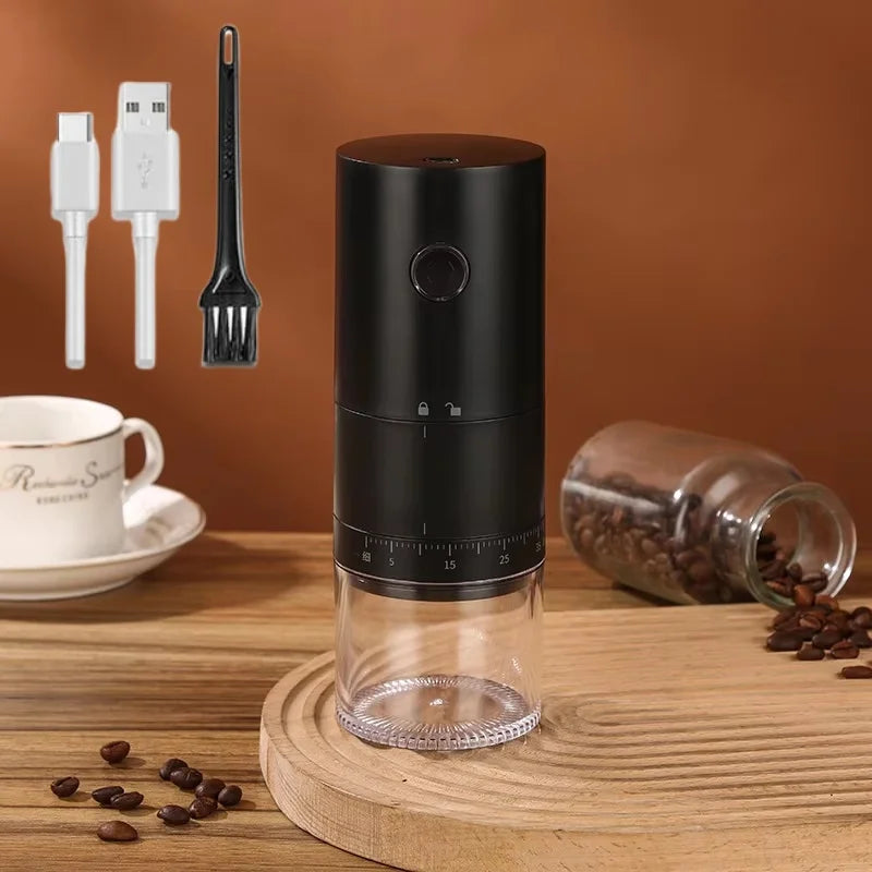Black portable electric coffee grinder with adjustable burr settings, transparent base, USB-C cable, and cleaning brush.