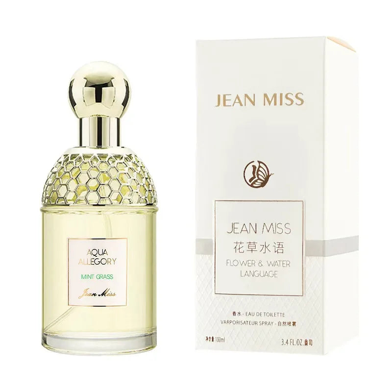 Jean Miss Aqua Allegory Mint Grass EDT 100ml: floral fragrance in a honeycomb-textured bottle with round gold cap.