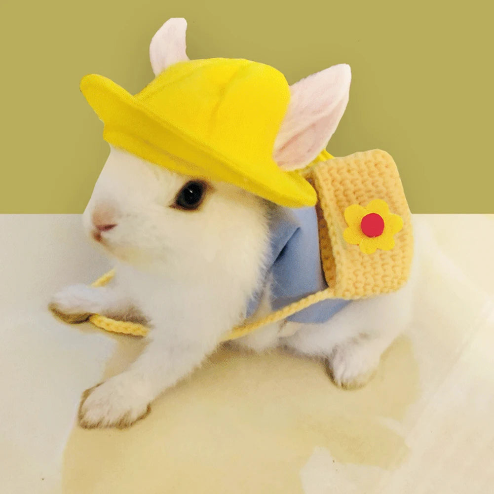 Cute rabbit wearing a blue vest, yellow hat, and floral bag. Stylish outdoor harness set for small pets and bunnies.