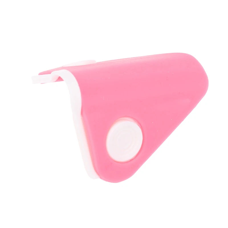 Pink silicone nose shaper lifting clip for nose bridge straightening and facial beauty contouring.