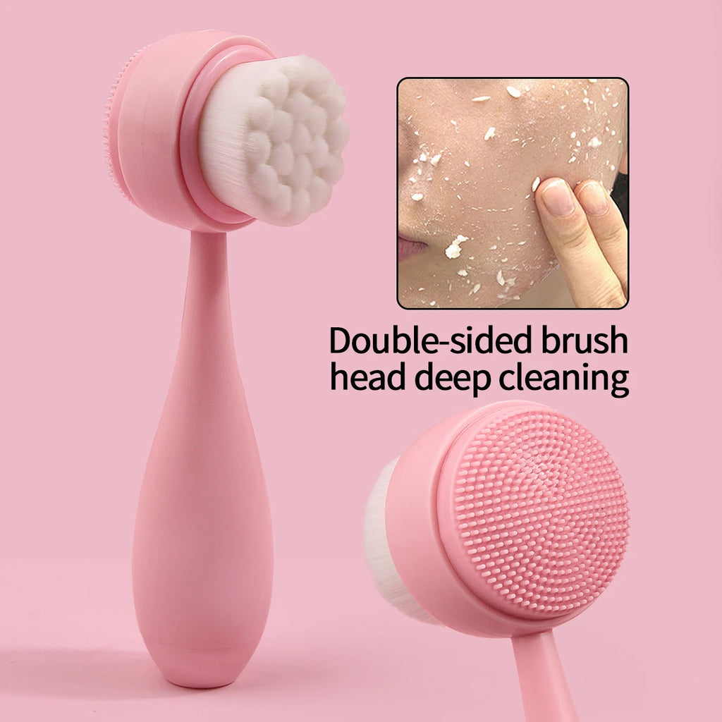 Pink double-sided manual facial cleansing brush with soft bristles and silicone scrubber for deep skin exfoliation.