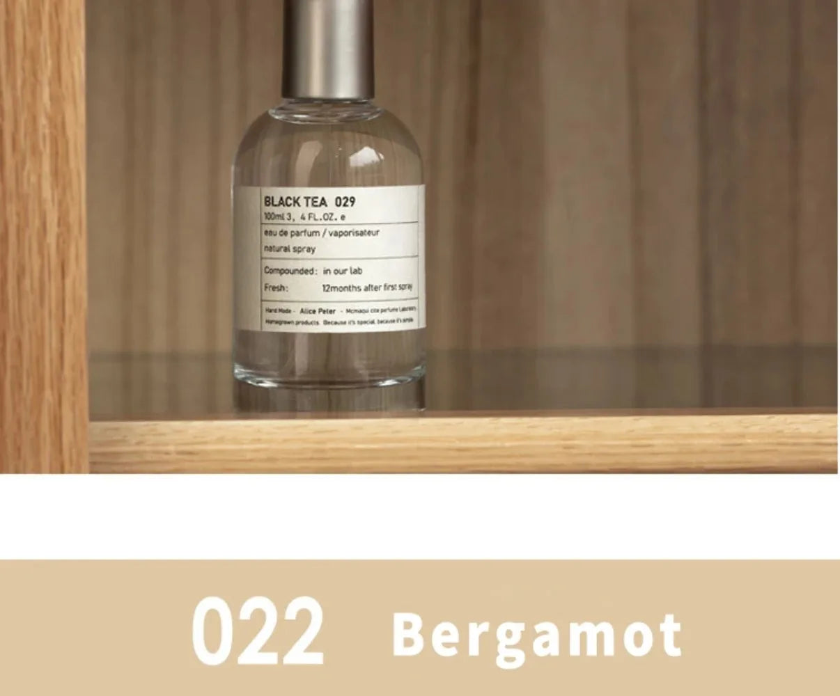 Black Tea 029 Eau de Parfum: 100ml unisex fragrance in round glass bottle, sandalwood, bergamot, and fresh fruit notes.