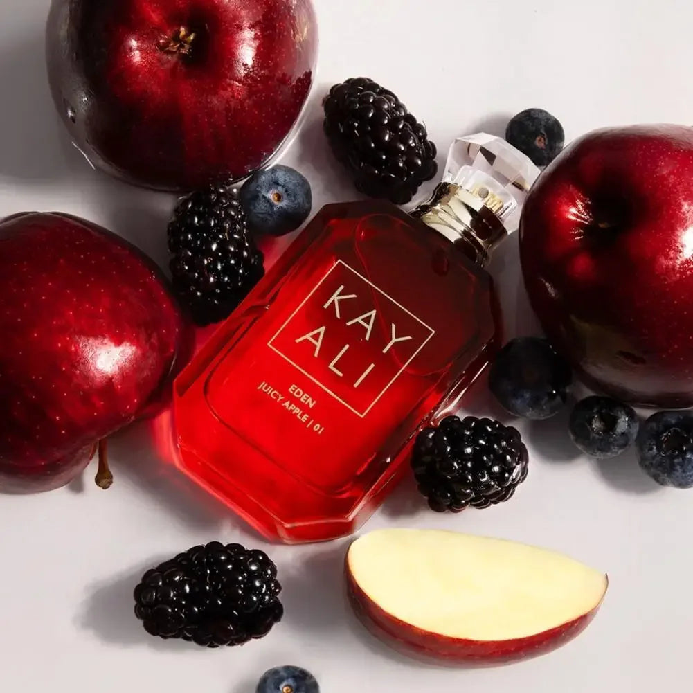 Kayali Eden Juicy Apple | 01 EDP: Floral fruity fragrance in a red glass bottle with fresh apples and berries.
