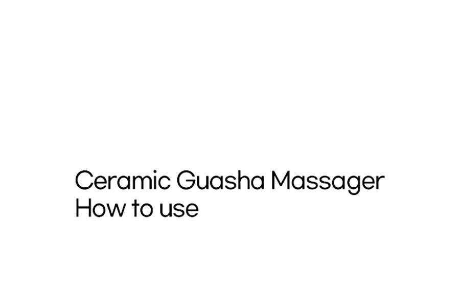 White ceramic gua sha tool for facial massage, featuring a curved, ergonomic shape for skin contouring.