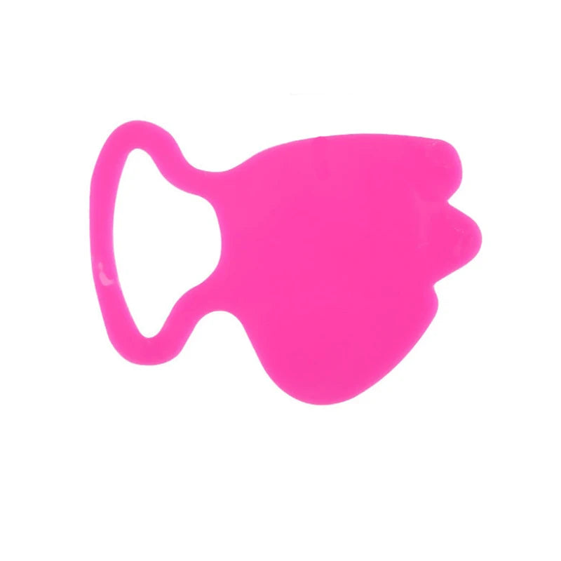 Bright pink, reusable silicone anti-wrinkle facial lifting patch with a rounded, ergonomic shape on a white background.